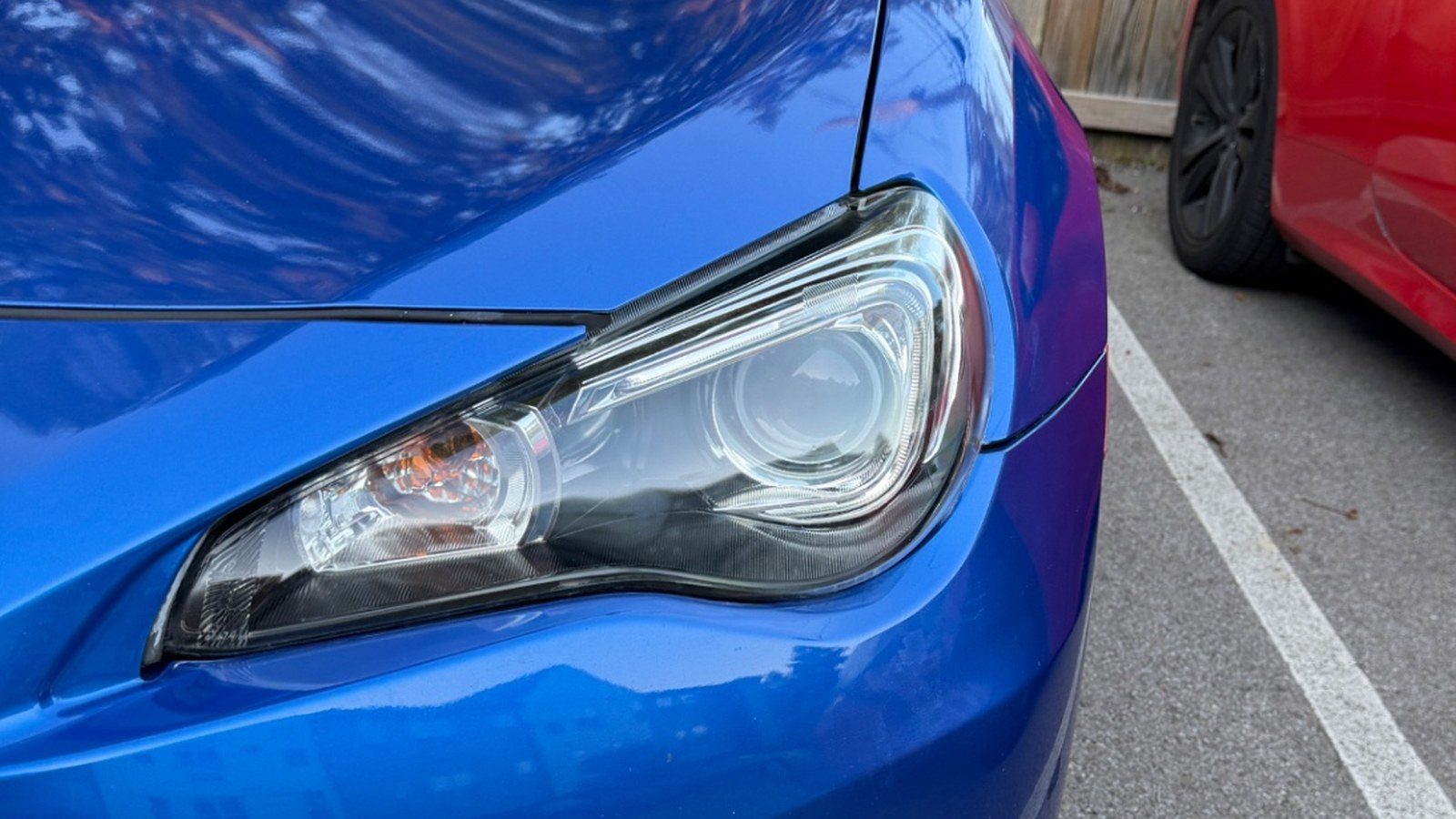 Crystal-clear restored headlight on a blue Subaru BRZ after a mobile restoration in Columbus, Ohio